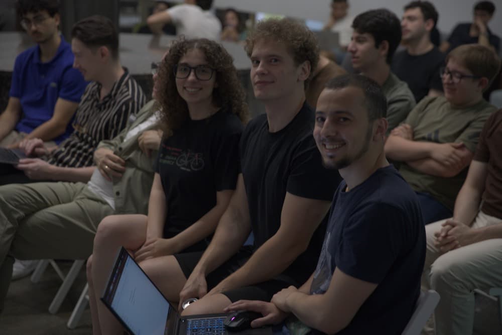 Builders sitting in an audience